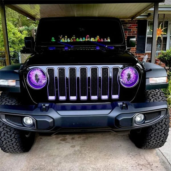 Frontal view of a Jeep's headlight with an installed Beast Eyes decal; custom automotive sticker