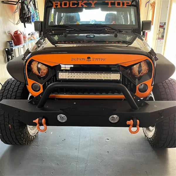 Jeep parked with Beast Eyes headlight decals, highlighting the aggressive look; vehicle customization
