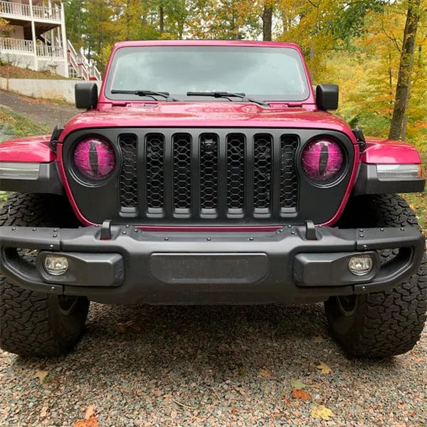 Jeep with Beast Eyes headlight decals in a natural outdoor setting; unique car styling, easy install