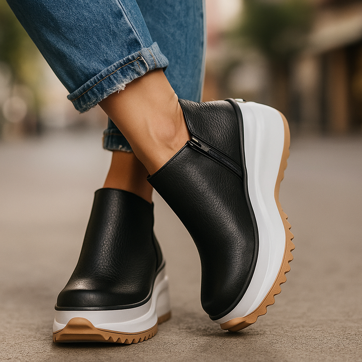 Women's black comfort platform shoes, designed with orthopedic support and a trendy textured finish.