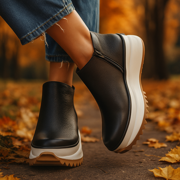 Close-up of a black orthopedic platform shoe for women, highlighting its comfort features and textured design.