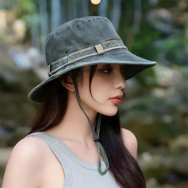Durable khaki unisex outdoor sun protection bucket hat with adjustable chin strap for hiking.