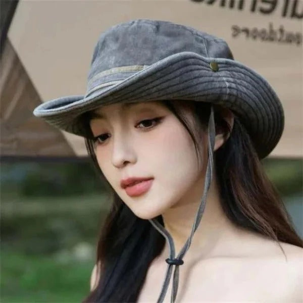 Green unisex bucket hat for fishing & outdoor activities, featuring sun protection & secure chin strap.