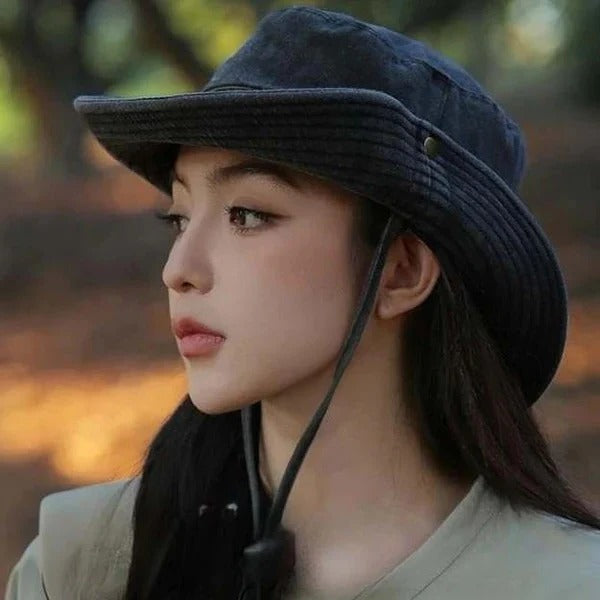 Stylish black unisex outdoor bucket hat with chin strap, perfect for sun protection during any adventure.