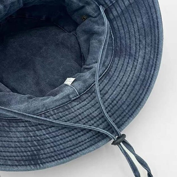 Vented, adjustable, and collapsible khaki unisex bucket hat with chin strap for ultimate sun protection.