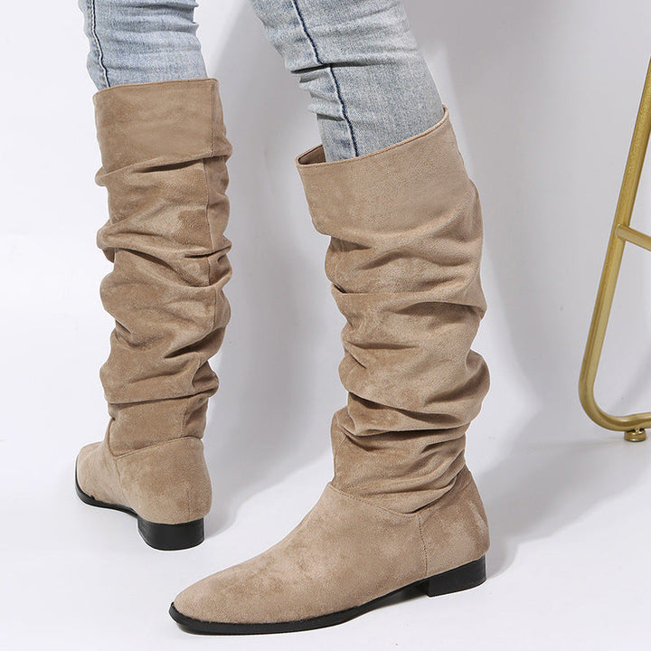 Stylish black slouchy knee-high boots for women featuring a comfortable, stable block heel