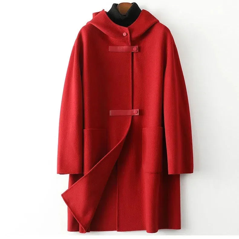Red women's winter coat, wool-blend, with hood and toggle fasteners, providing warmth and style.