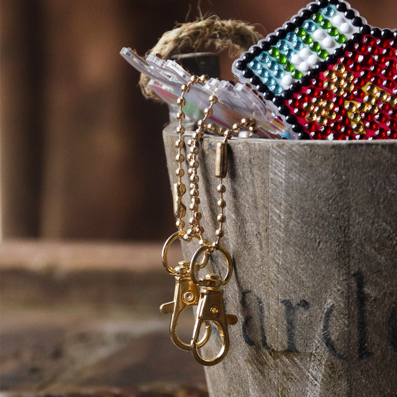 DIY Christmas craft activity for kids featuring festive diamond designs