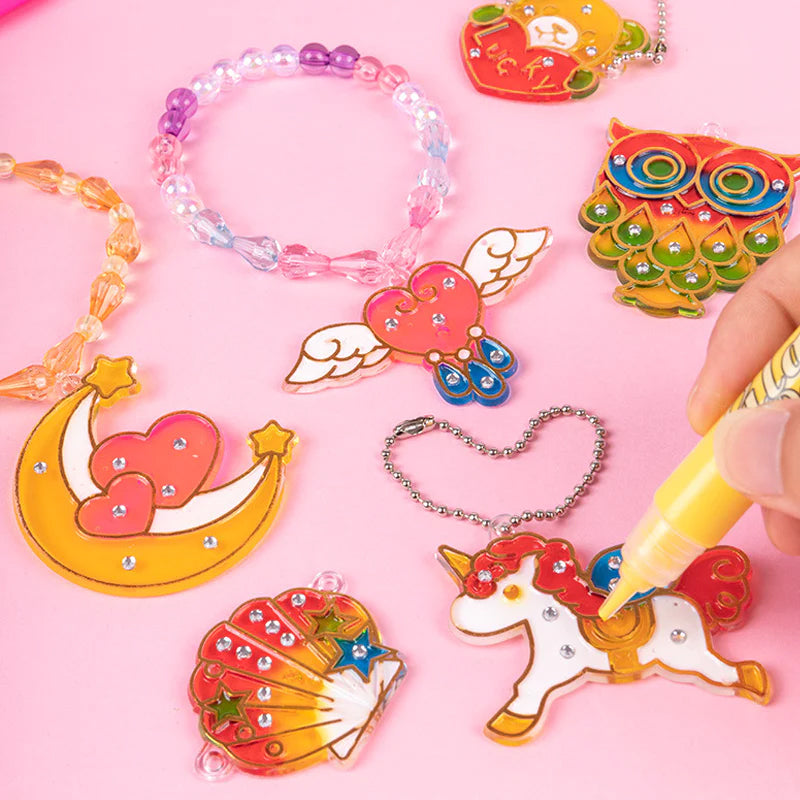 Close-up of a child's hand carefully placing crystals on a DIY painting craft kit