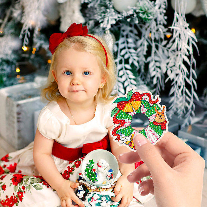 Close-up of kids' hands meticulously placing mini diamonds on a holographic suncatcher sticker from art kit