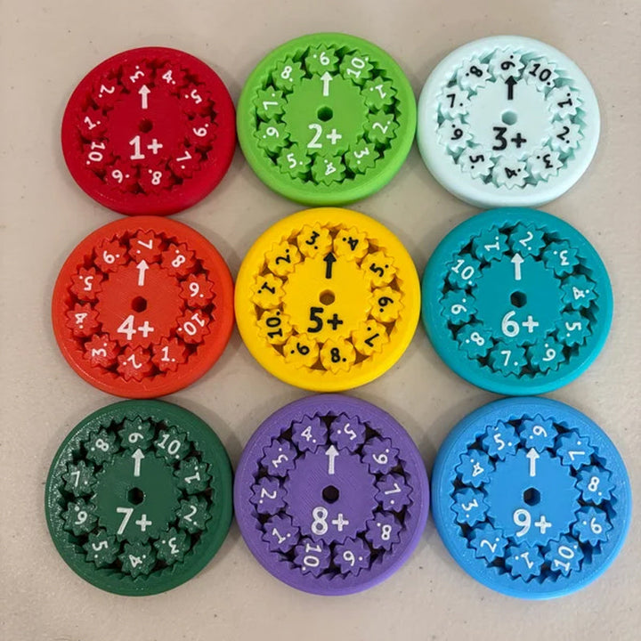 Tabletop view of multiple Math Fidget Spinners, learning tools for basic math