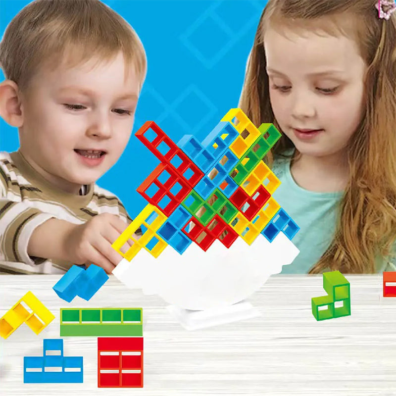A child carefully balancing pieces on the Swing Stack-Up educational toy, enhancing motor skills.