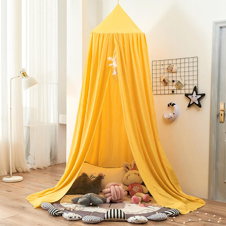 Kids' room decor: a beautiful hanging bed net canopy, enhancing the magical ambiance for sleep.