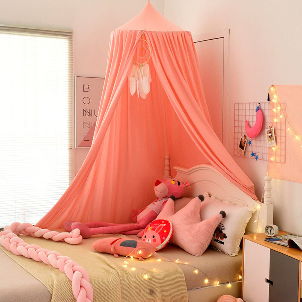 Nursery decor: a charming hanging bed net canopy, creating a whimsical and cozy sleep area.
