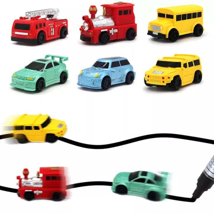 Hand holding a red inductive car toy, ready to follow a drawn path