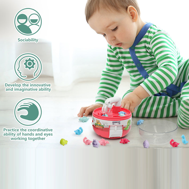 Child playing with a Mini Dinosaur Claw Machine, a fun and interactive kids' gift.