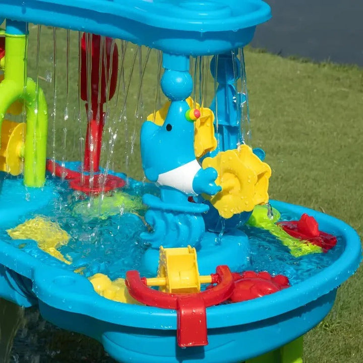Children playing happily with the all-in-one outdoor sand & water play table, fostering sensory & backyard fun.