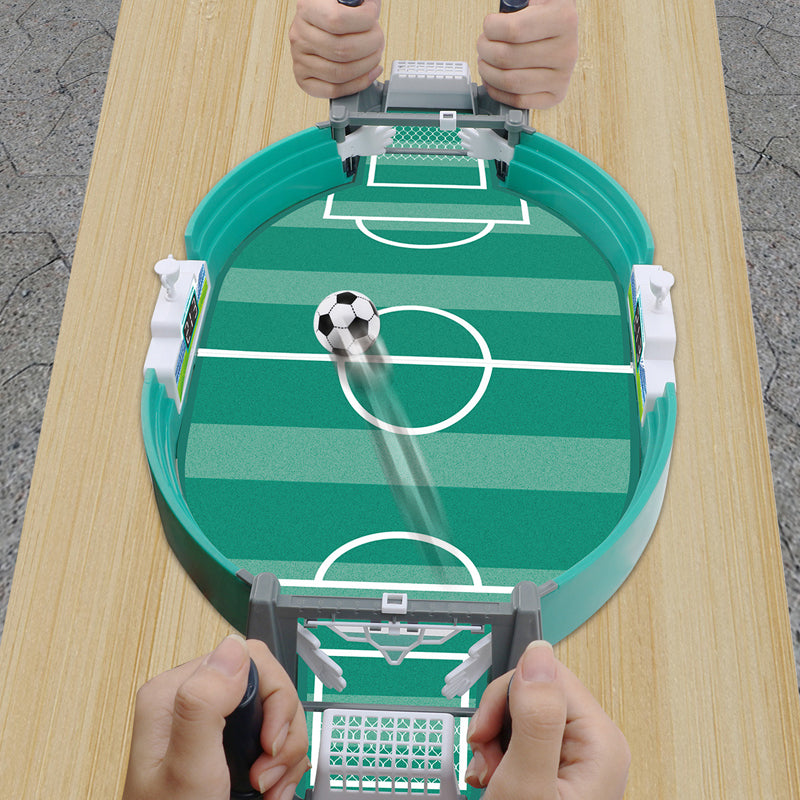 Close-up of interactive tabletop soccer game with mini players, aiming for goal, sport toy for kids