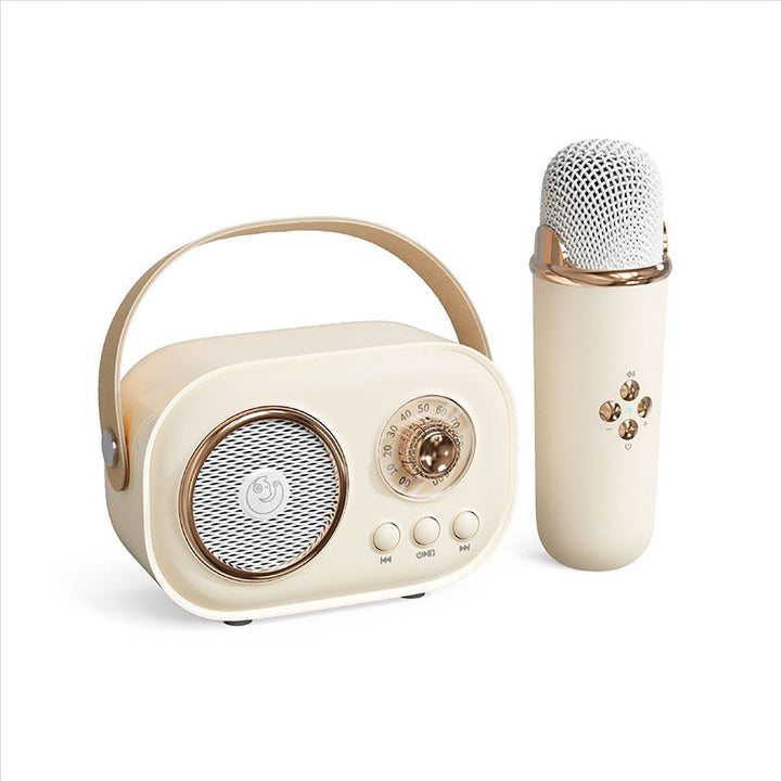Unboxing a new kids' portable karaoke speaker with wireless microphone, revealing all accessories.