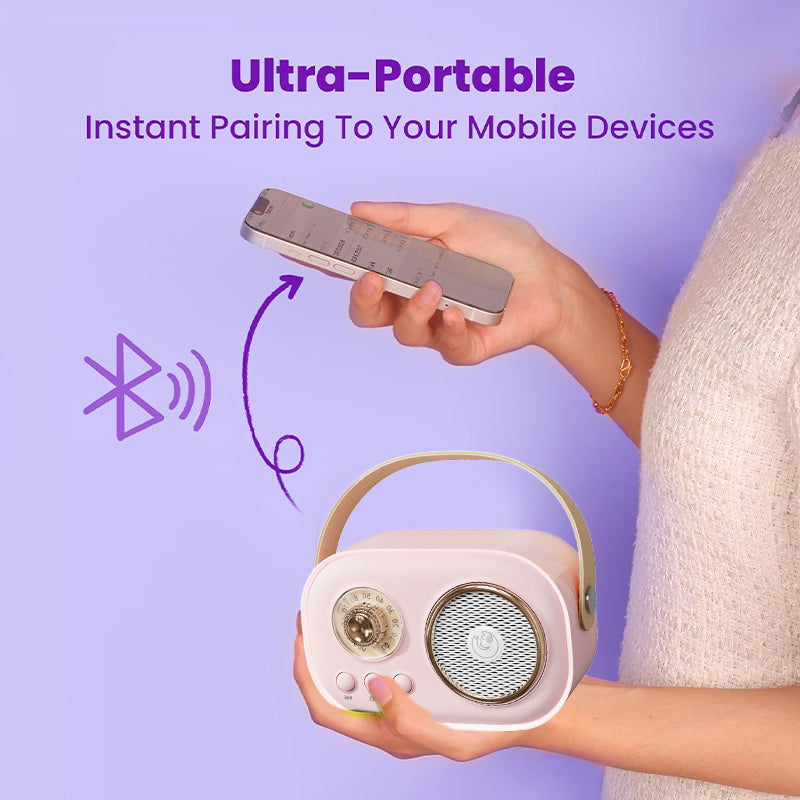Wireless microphone for kids' karaoke speaker, silver, held by a child's hand, enhancing musical play.
