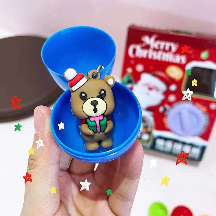 Close-up of a child's hand operating the joystick of a mini claw machine toy, interactive playtime