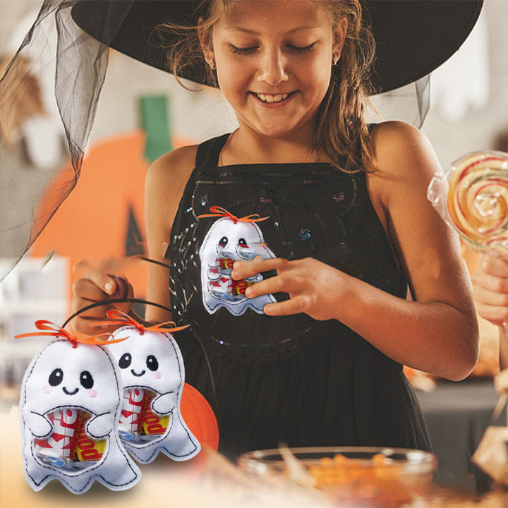 Stack of folded kids' Halloween treat bags, showcasing both ghost and pumpkin designs for parties