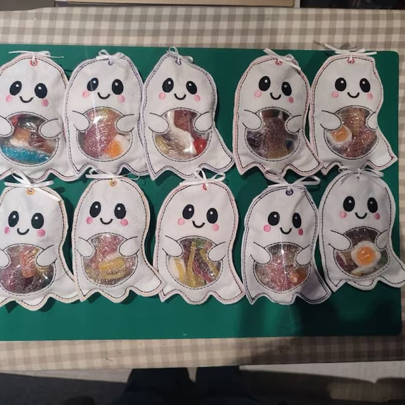 Close-up detail of the durable fabric and playful ghost design of a kids' Halloween treat bag