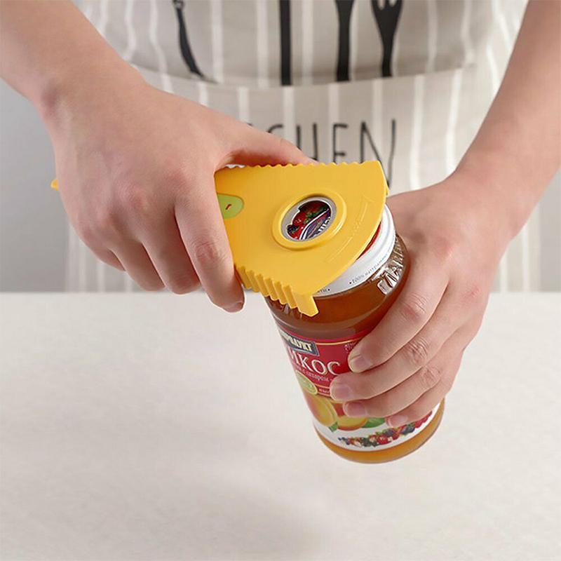 Hand holding an easy grip kitchen utensil to open a jar or bottle with anti-slip design