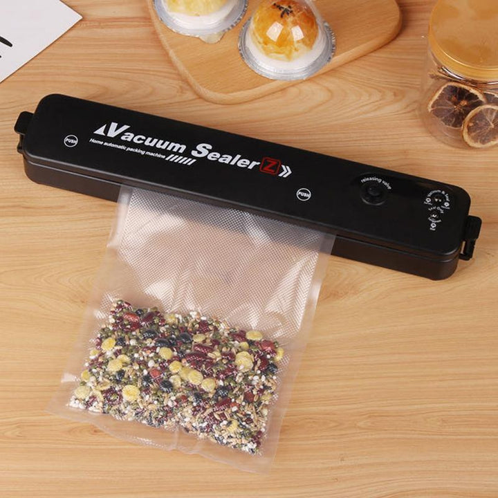 Food storage solution: a compact vacuum sealer, perfect for keeping groceries fresh longer.