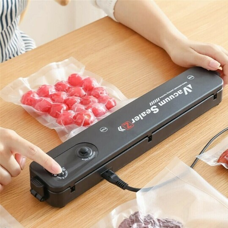 Compact vacuum sealer machine for kitchen, ideal for extending food shelf life and reducing waste.