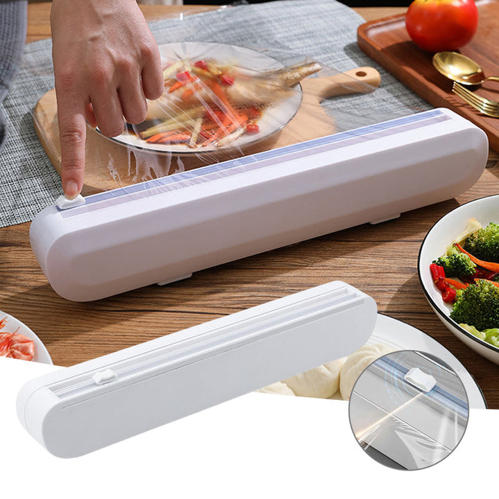 Kitchen wrap dispenser with precision cutter for foil, cling film & baking paper; modern kitchen organizer.