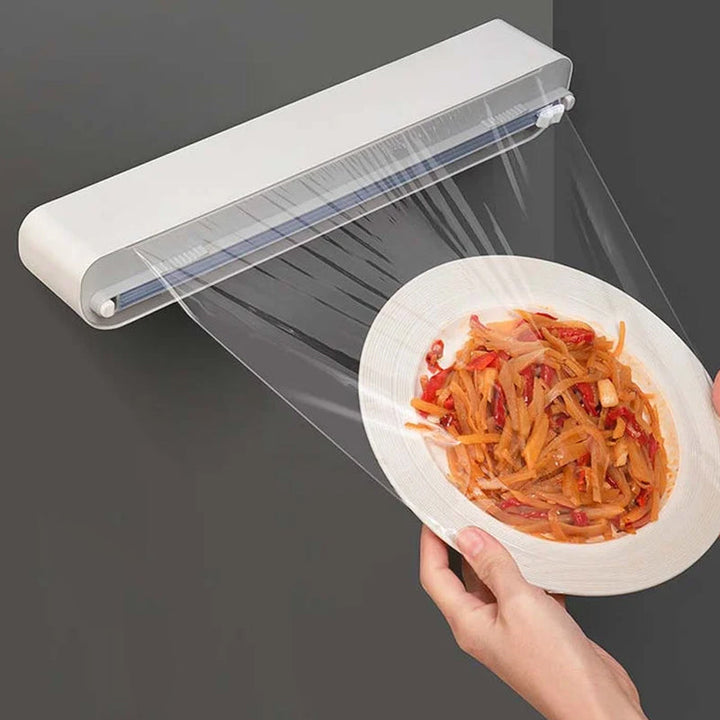 Bamboo kitchen wrap dispenser with integrated slide cutter, ideal for food storage and baking paper rolls.