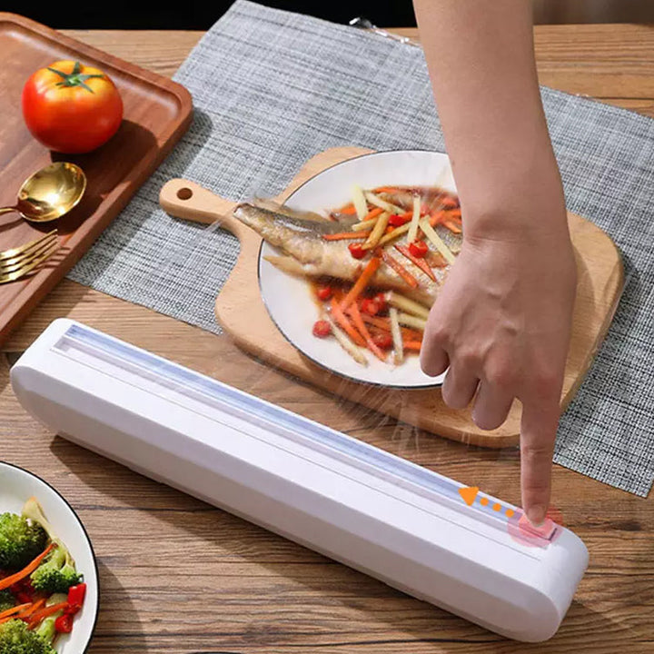 Compact kitchen wrap dispenser featuring a sliding cutter for clean breaks; perfect food storage solution.