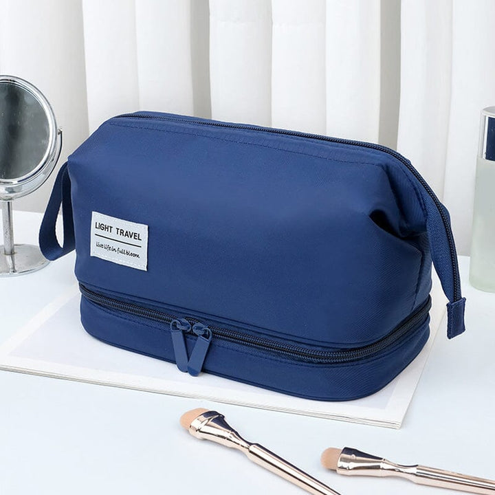 Large toiletry organizer bag, laid flat to display all internal compartments, ideal for comprehensive bathroom storage.