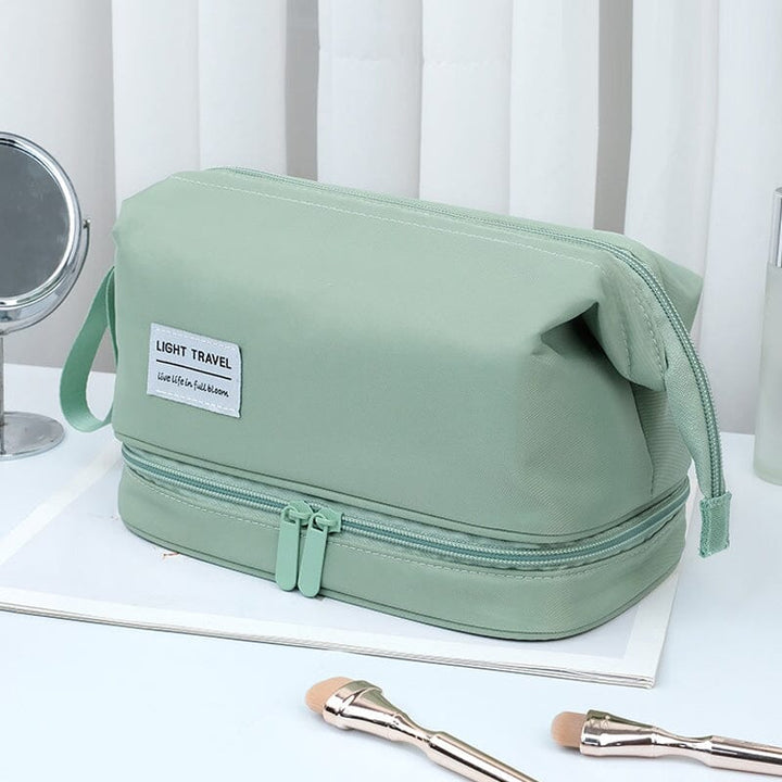 Portable waterproof toiletry bag with a strong hanging hook, ready for use in a shower or hotel bathroom.