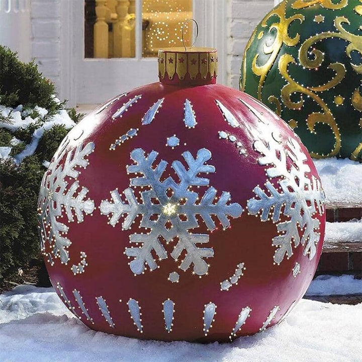 Red inflatable Christmas ball with built-in LED lights for outdoor holiday nighttime glow