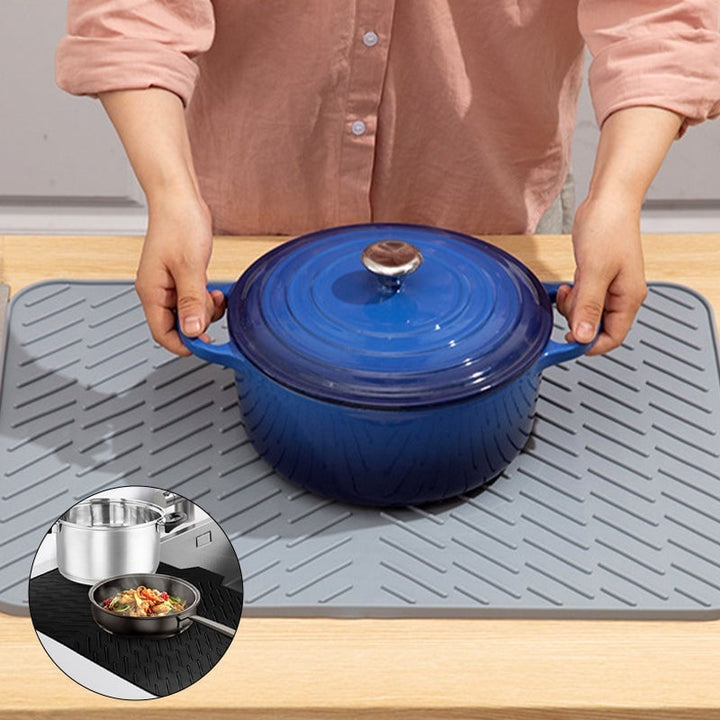 Heat-resistant silicone dish drying mat, black, draining dishes on kitchen countertop, household essential