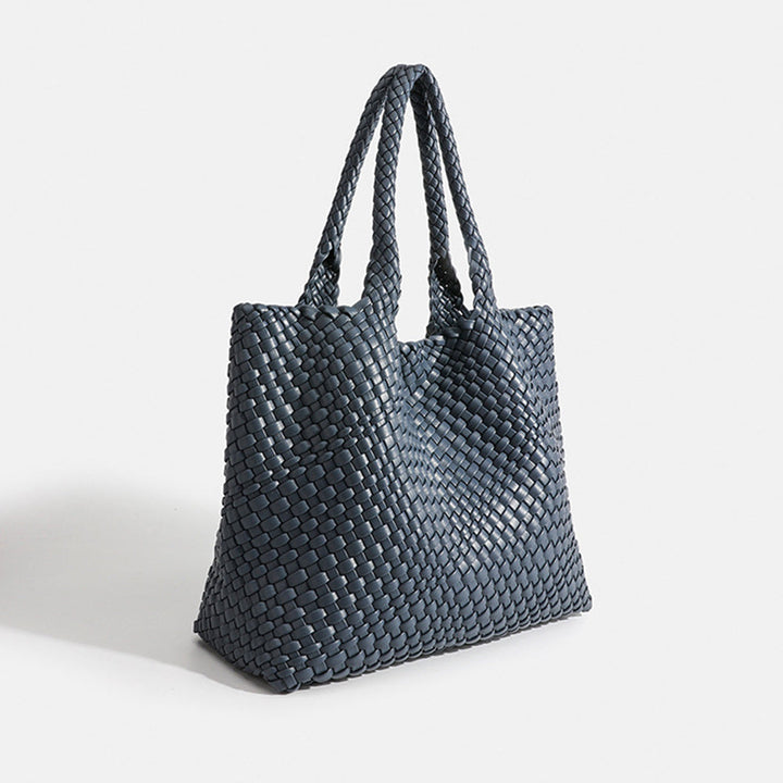 Fashionable women's woven shoulder bag, a chic large tote for versatile styling.