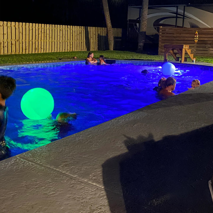 Dusk scene with an LED Luminous Beach Ball glowing, perfect party light