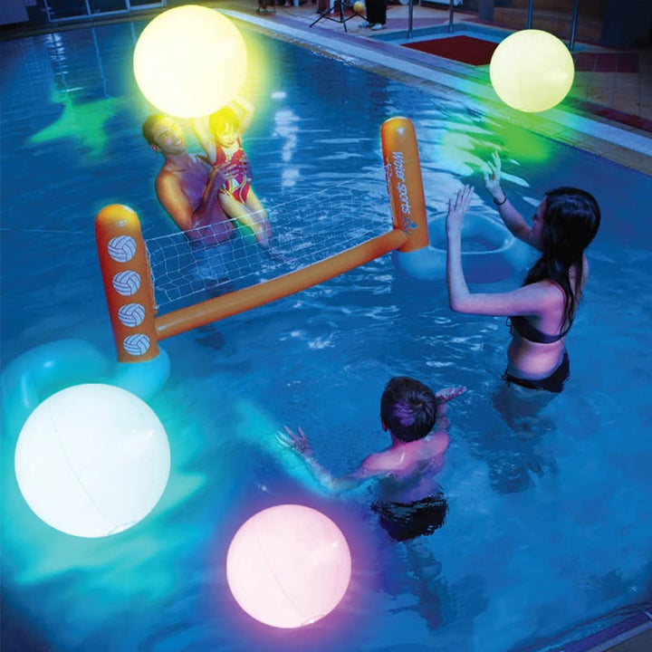 Family enjoying outdoor fun with a large LED inflatable beach ball
