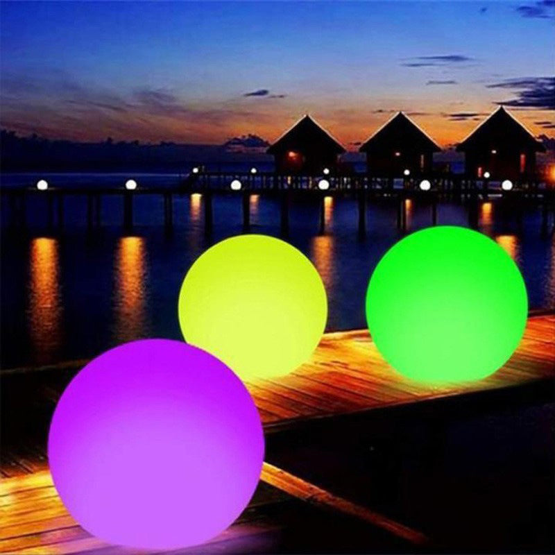 Waterproof LED Beach Ball glowing brightly at night, perfect for outdoor decor