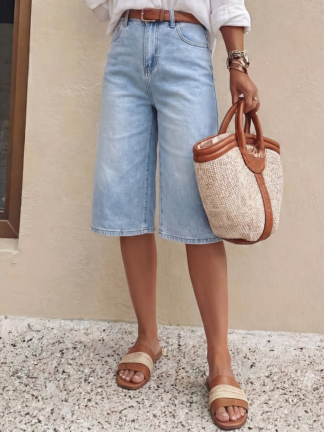 Model wearing light blue high waist culotte shorts, wide leg cropped for comfortable everyday style.