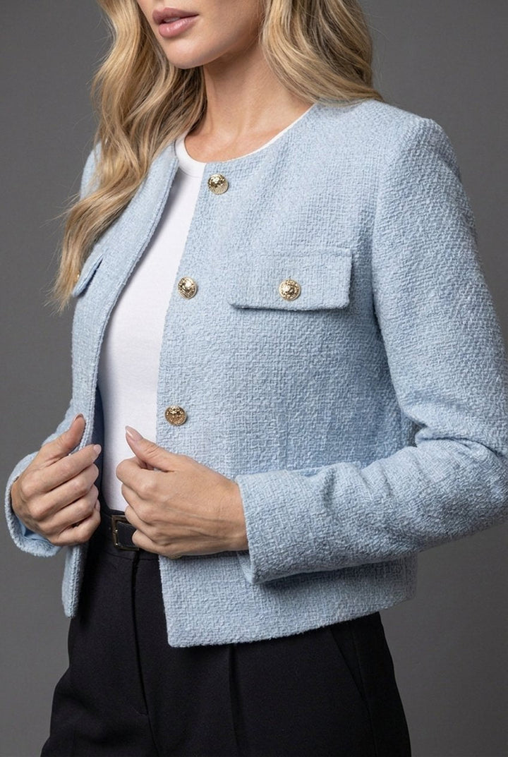 Versatile women's textured cropped collarless blazer, chic gold buttons. Perfect for elevating any smart or casual outfit.