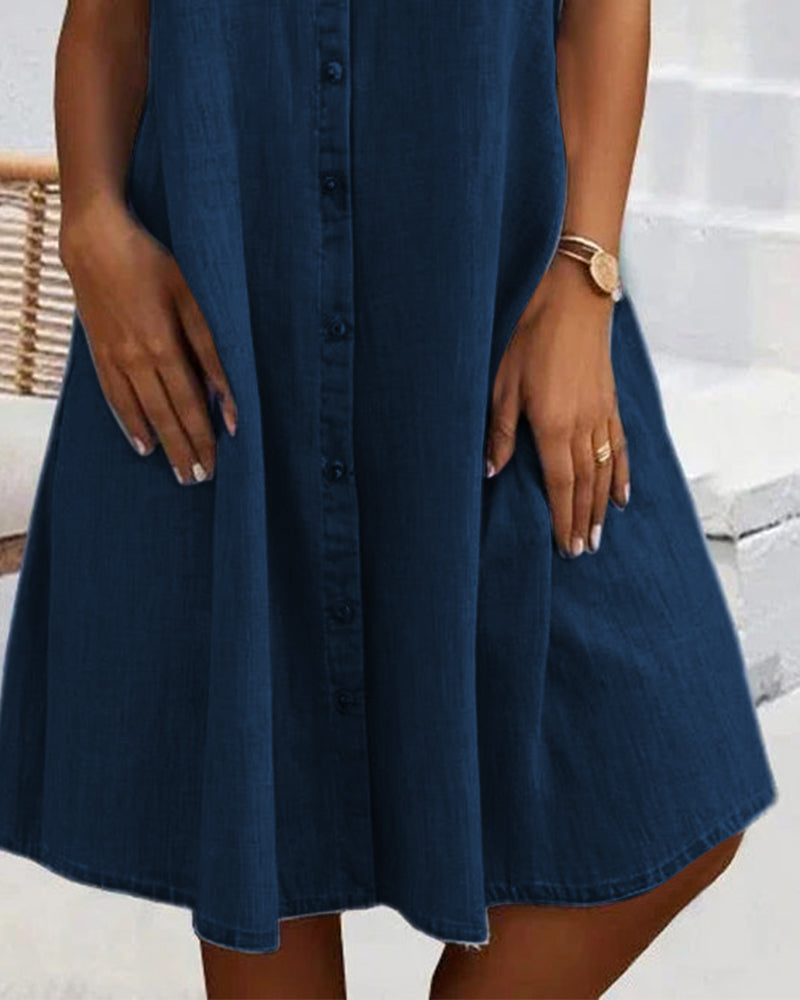Close-up of a women's lightweight denim-look shirt dress with button-down detail, perfect for casual elegance.