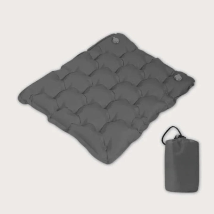 Lightweight travel seat cushion for outdoor camping, hiking. Portable & comfortable for adventures.