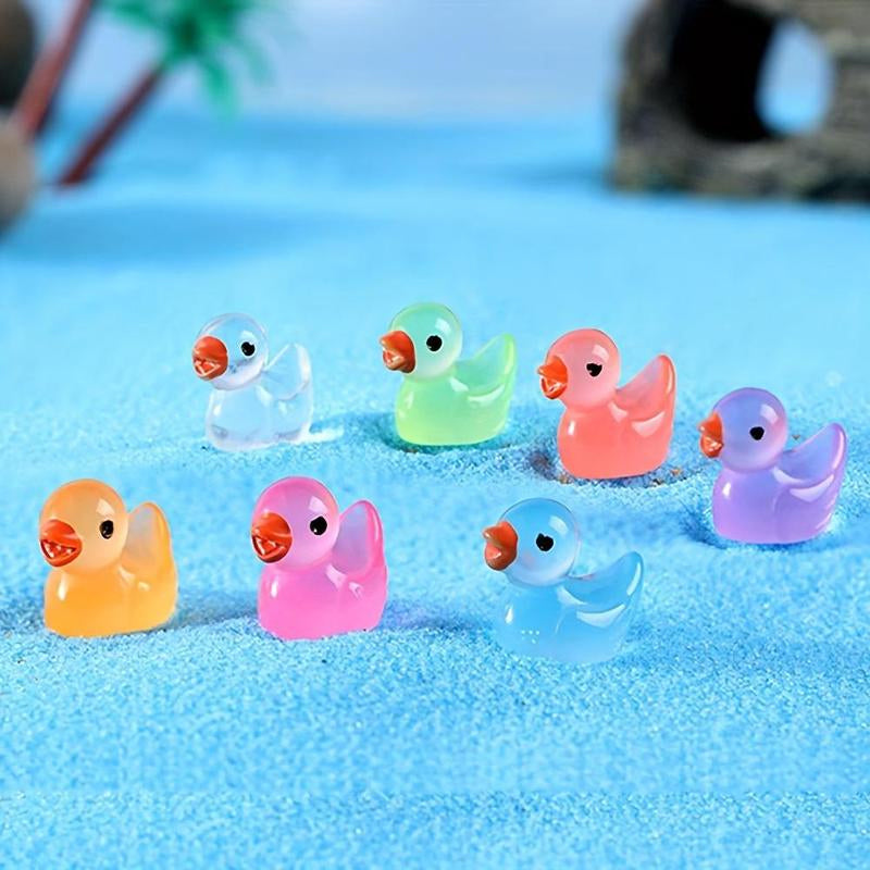 Close-up of a glowing mini duck figurine, made of resin, ideal for miniature garden scenes.
