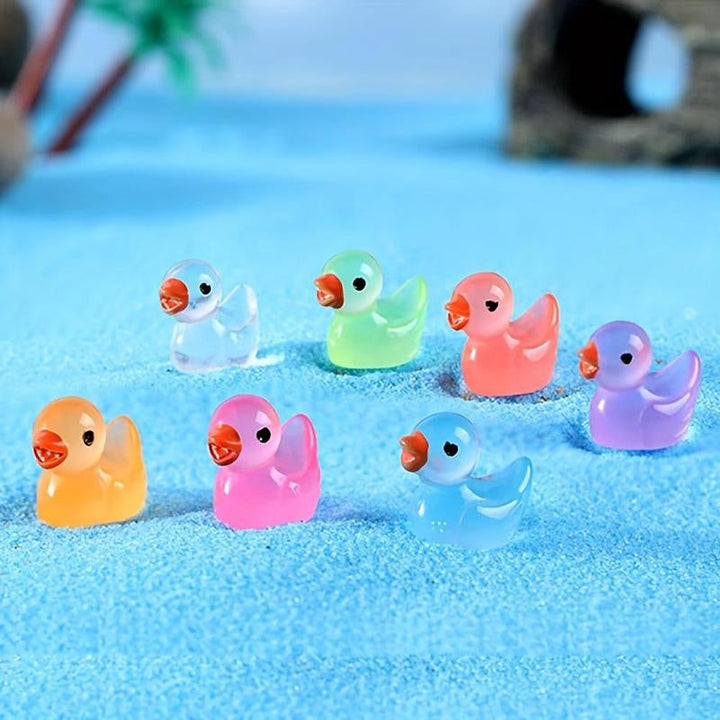 Close-up of a glowing mini duck figurine, made of resin, ideal for miniature garden scenes.