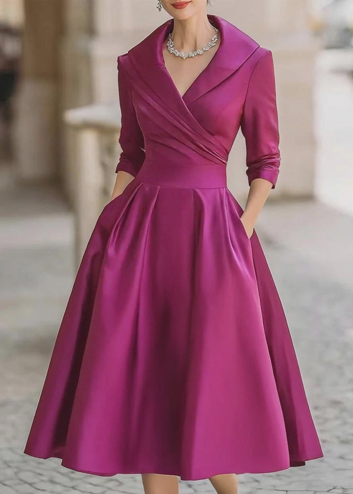 Timeless women's cocktail dress, a lustrous midi style with a chic draped collar and pockets.