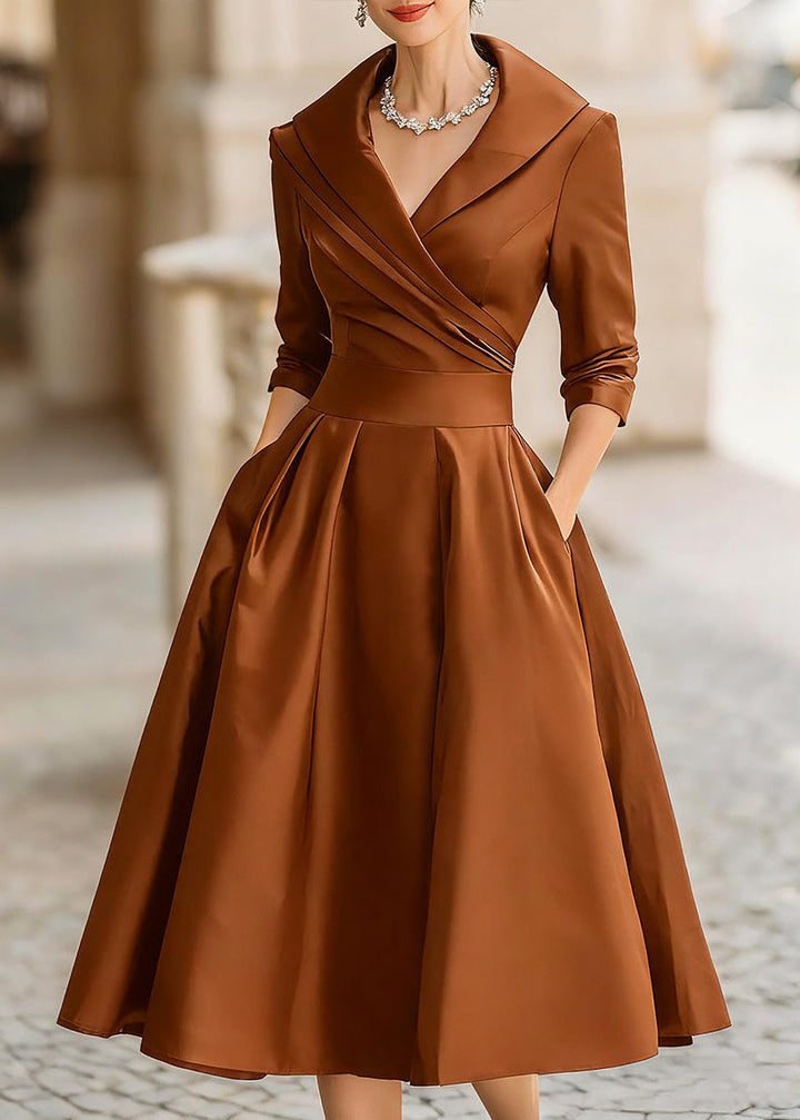 Modest yet elegant women's special occasion midi dress, draped collar, lustrous fabric, pockets.