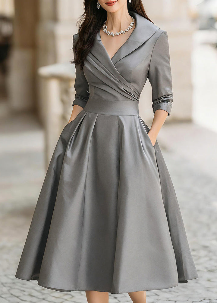 Party-ready women's midi dress: lustrous A-line, sophisticated draped neck, and convenient pockets.